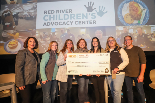 R.D. Offut Company team members present Red River Children Advocacy Center with 100% of the funds raised at this year's potato luncheon
