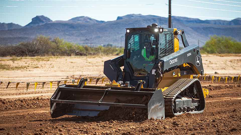 compact track loader using gravel bucket
