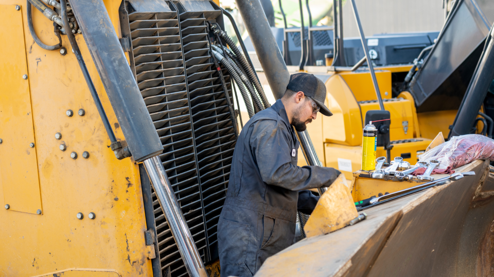 rdo service technician working on a john deere machine