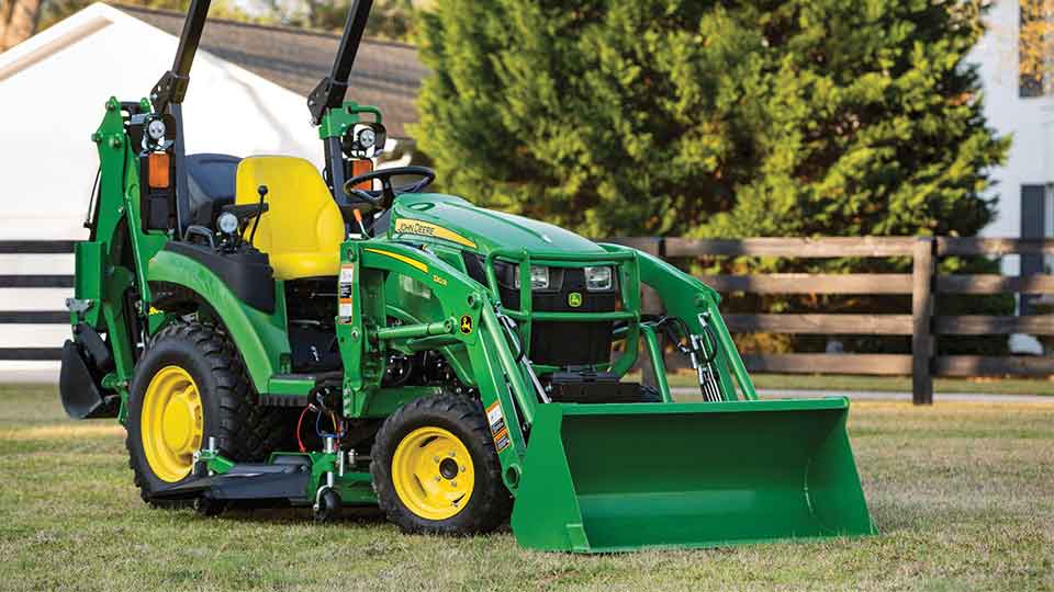 John Deere E Series Compact Utility Tractor in Yard