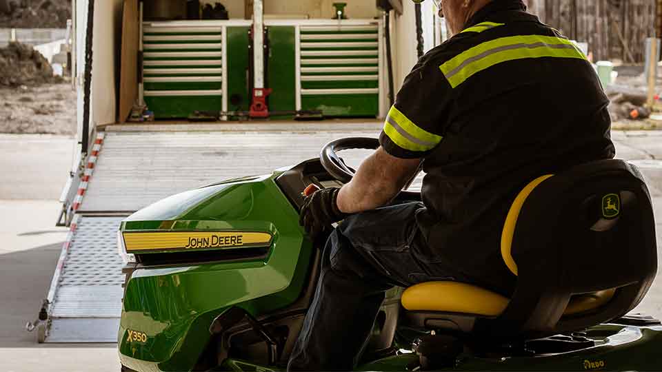 Man riding riding lawn tractor x350