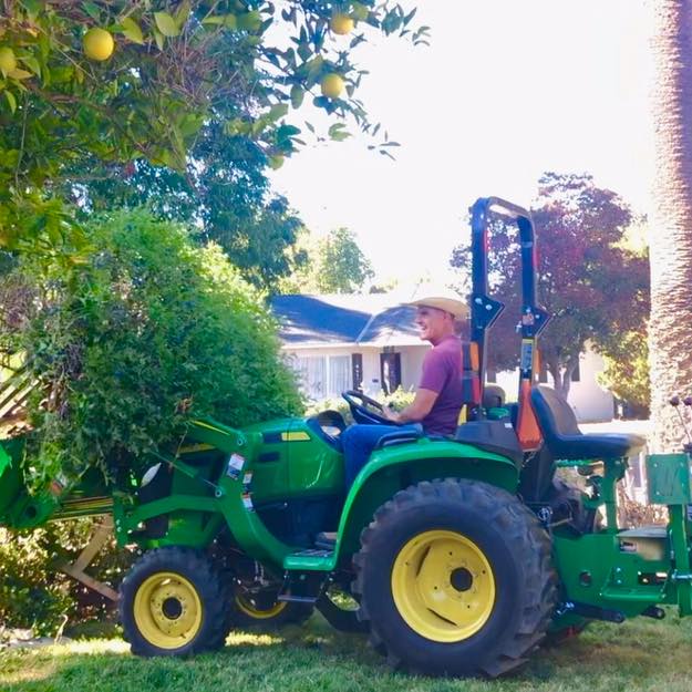 DIYer Brett Waterman removing tree with John Deere Tractor