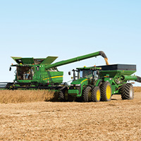 John Deere combine and tractor harvesting