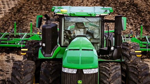 Autonomous tractor in the field tilling in North Dakota