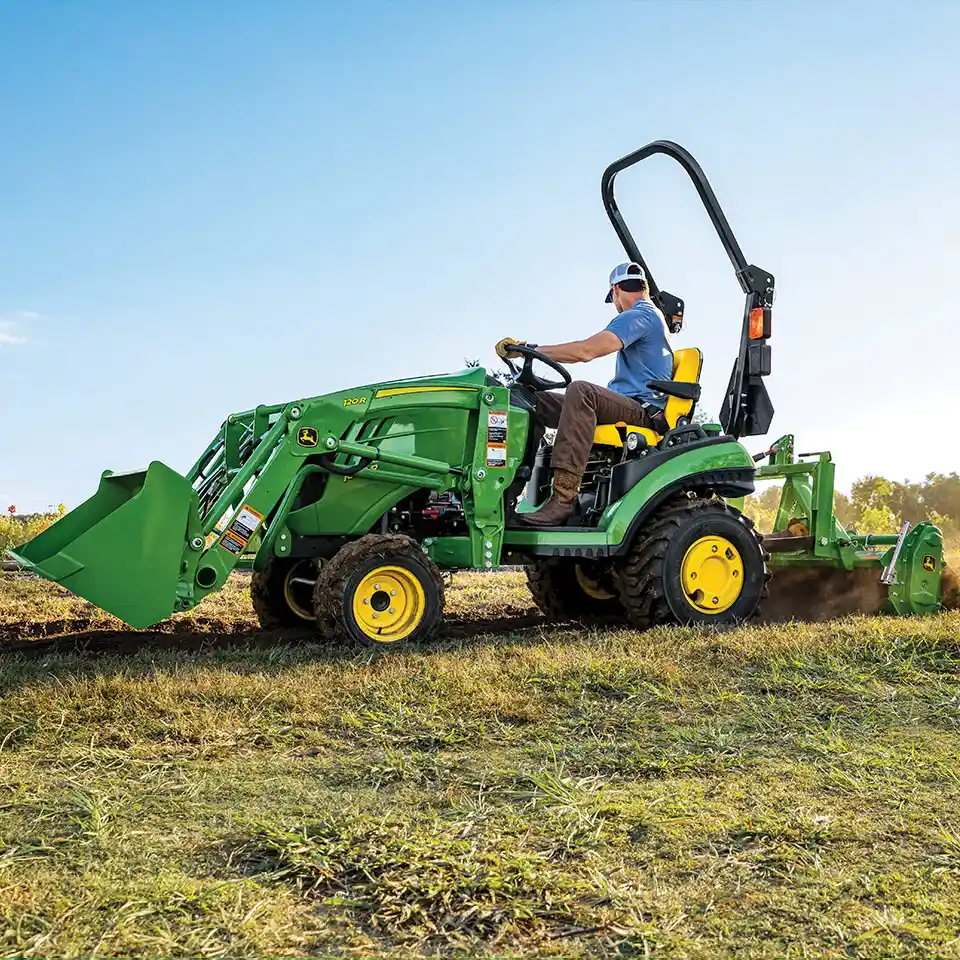 John Deere 1025 compact tractor with Frontier tiller