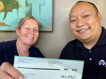 Nhia Vue, Store Manager, RDO Equipment Co. — Fowler, CA, presents Deborah Riordan, Central Valley Veterans Board President, with a Community Builder Grant from the Offutt Family Foundation. 