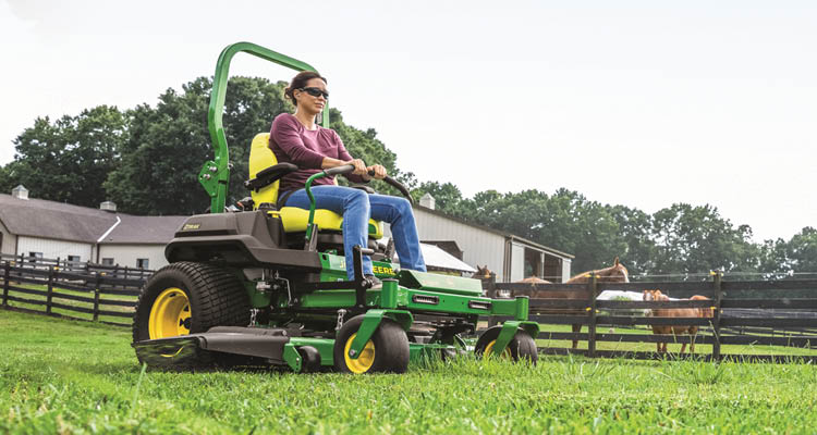 John Deere Z760R ZTrak mower mowing a lawn on a horse farm.