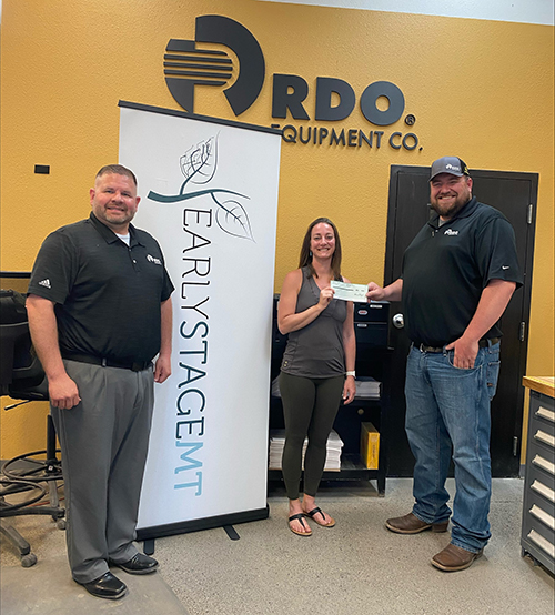 Adam Gilbertson,  RDO Equipment Co. Vice President of Midwest Construction and Integrated Controls,  stands with Jenni Graf, ESMT Brian Jensen, Bozeman Store Manager and I when we presented the check.