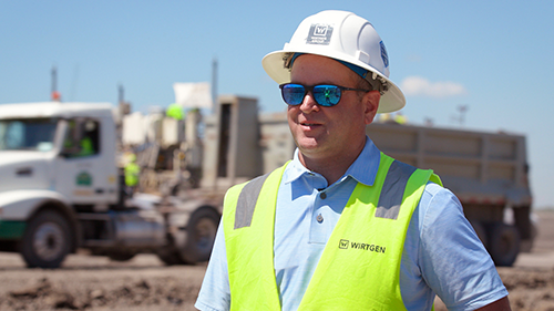 Eric Sahr - WIRTGEN GROUP Product Manager stands at Northern Improvement's roadbuilding site in North Dakota.
