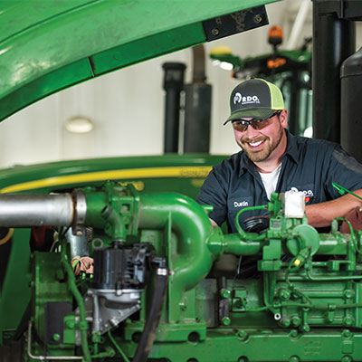 rdo technician examining john deere machinery