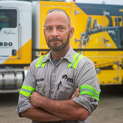 field technician in front of truck