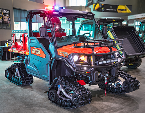 Painted firetruck red and equipped with a 70-gallon water tank and a bed designed to hold a rescue basket or Stokes basket, the customized XUV835M John Deere Gator is a multifunction emergency response vehicle. 