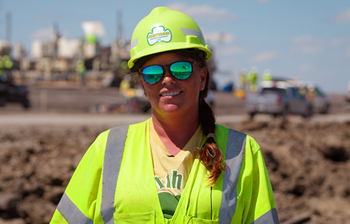 Jill Berger, foreman, stands at roadbuilding site near Exit 50 in North Dakota 