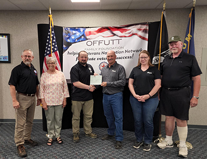 John Hurd, Store Manager, RDO Equipment Co. —  Billings, ND, presents Veterans Navigation Network members with a Community Builder Grant from the Offutt Family Foundation. 