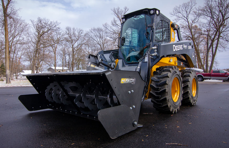 John Deere Skid Loader with Musk Ox attachments