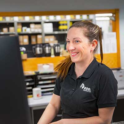 parts employee behind parts counter