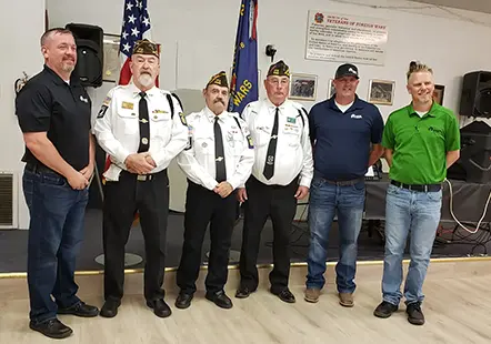 Jason Kreps, Store Manager, RDO Equipment Co. —  Sunnyside, WA, presents Sunnyside Veterans of Foreign Wars Post members with a Community Grant from the Offutt Family Foundation. 