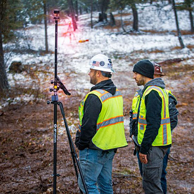 two rdo support personnel using precision technology construction site