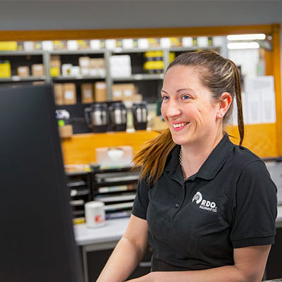 parts manager behind parts counter