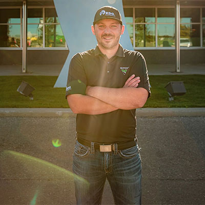 Matt Saar Regional Aftermarket Manager in Front of Store