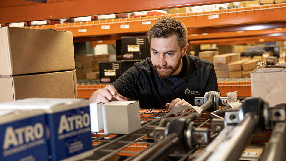 parts specialist doing inventory in warehouse
