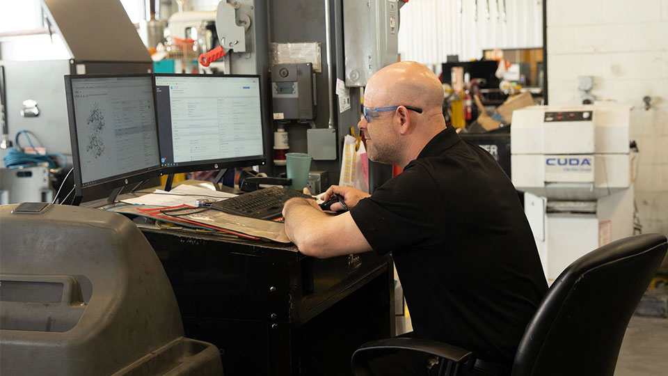 service manager talking on the phone to job candidate