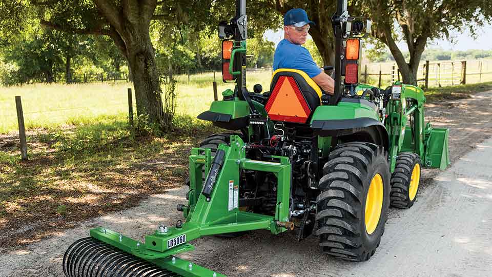 2 Series John Deere Compact Tractor With Rake Attachments