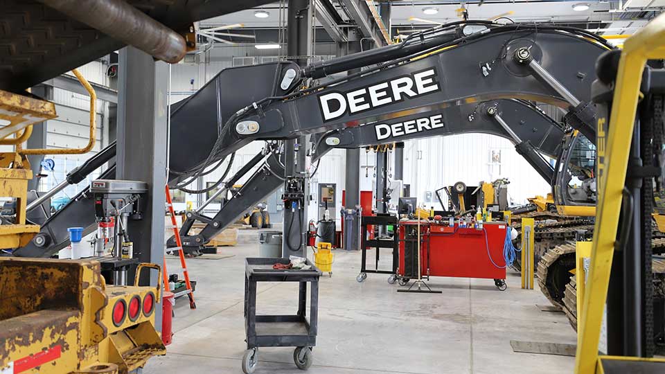 service bay with john deere construction equipment