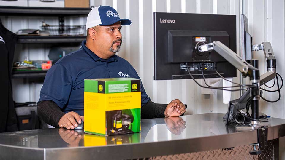 parts counter with team member checking out machine part