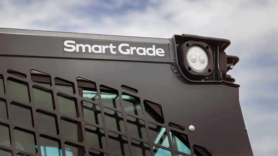 Compact track loader smartgrade logo on cab