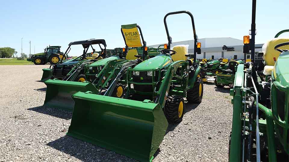 Compact Utility Tractors Lined Up on RDO Store Lot