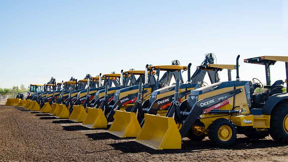 John Deere Bulldozers lined up in dealership lot