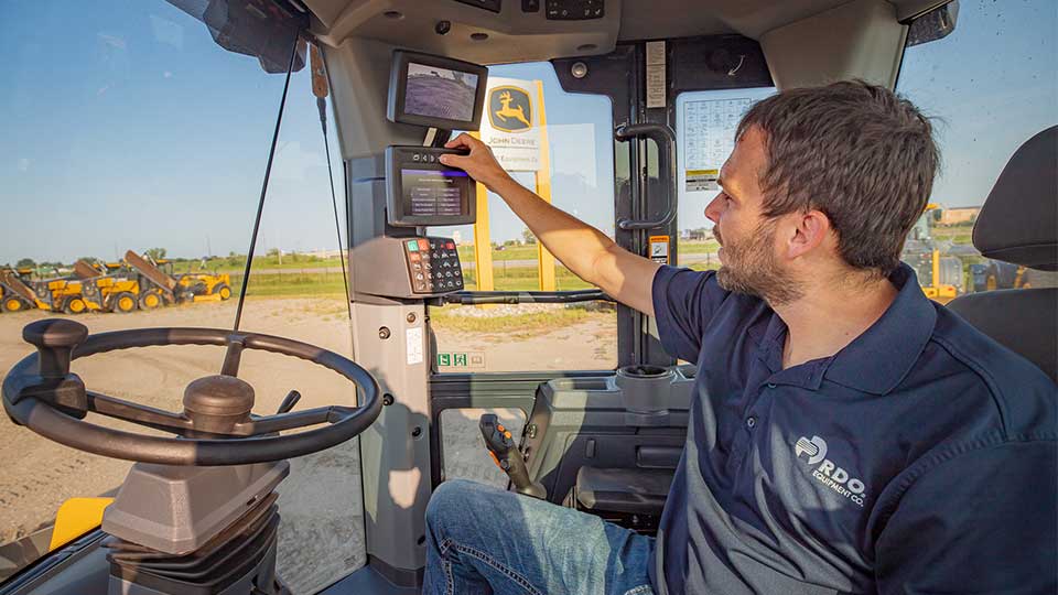 RDO Sales Person in Cab of Machine