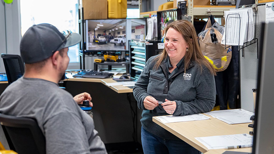 parts employees talking in office