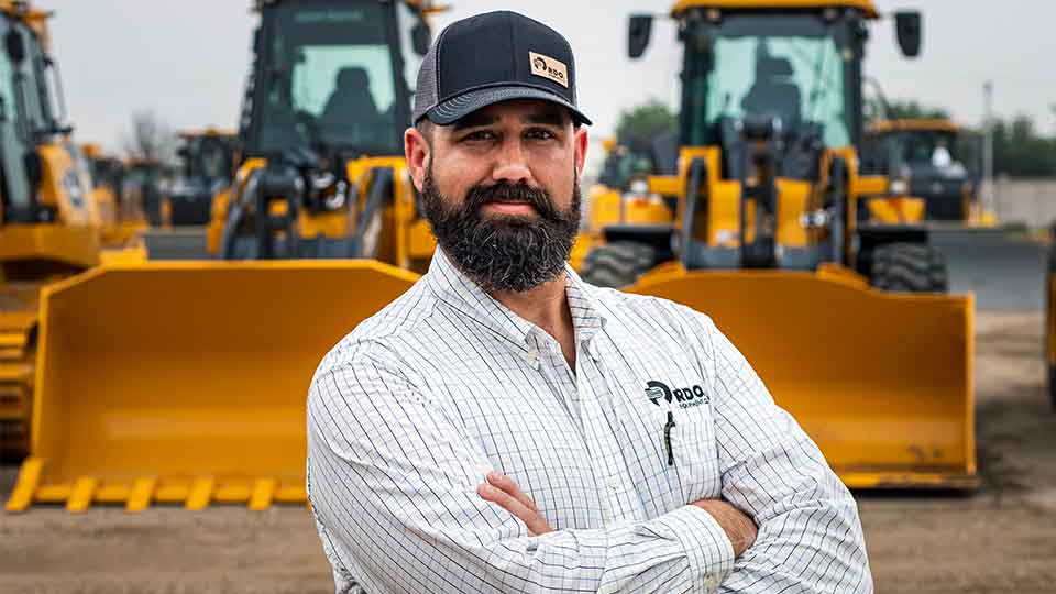 Field service manager in yard at store