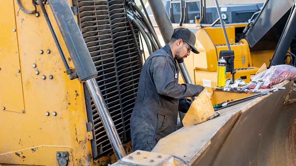Service technician working on equipment in the field