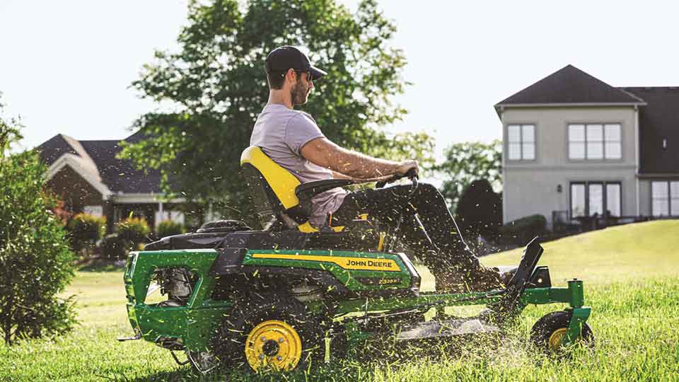 Man driving John Deere Z320R