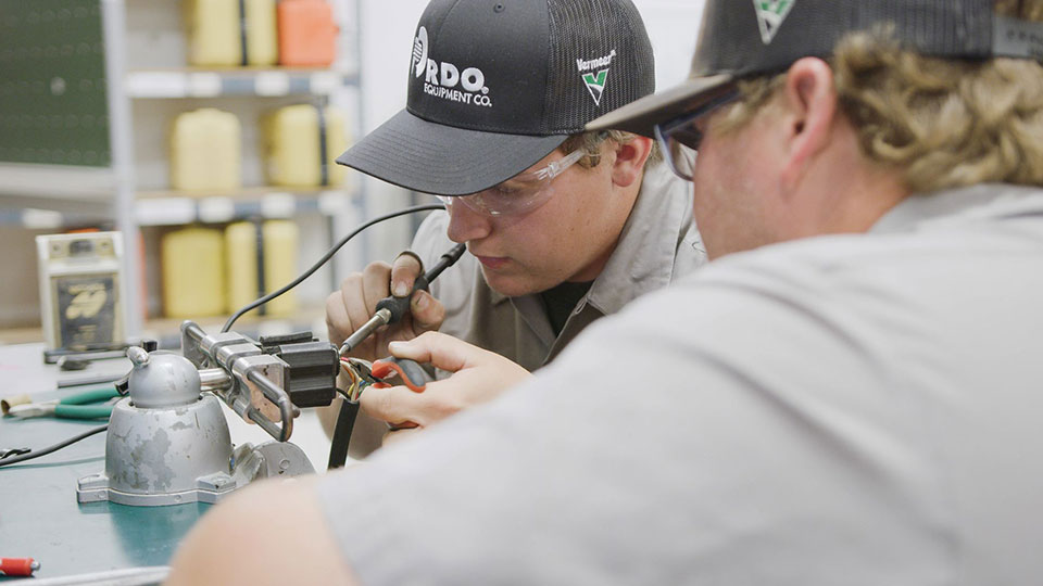 two technicians working on electrical training from Vermeer