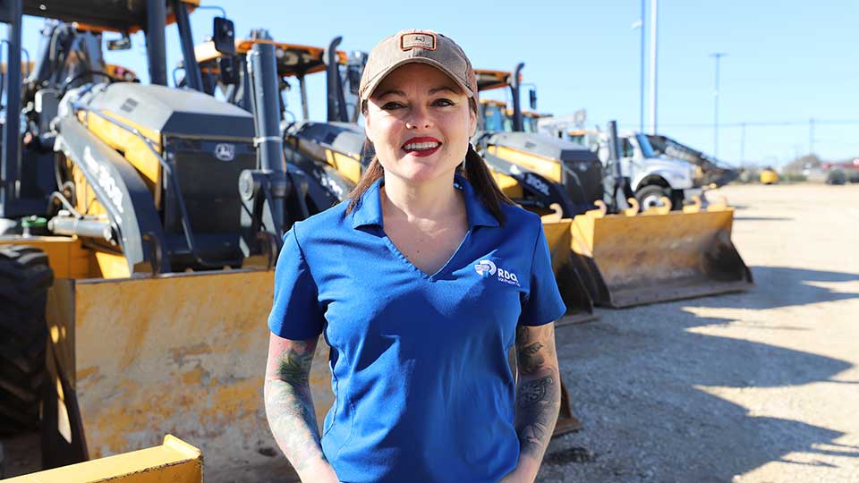 RDO Sales Person in front of bulldozers
