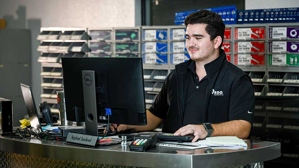 Parts person behind parts counter