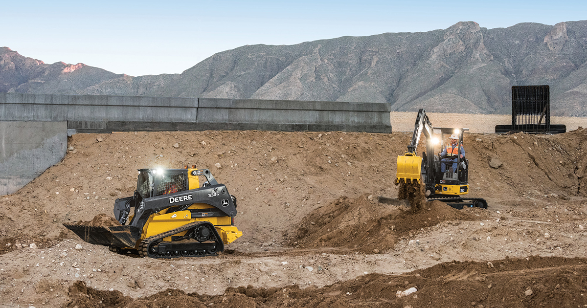 John Deere skid steer and mini excavator working on a earth work site