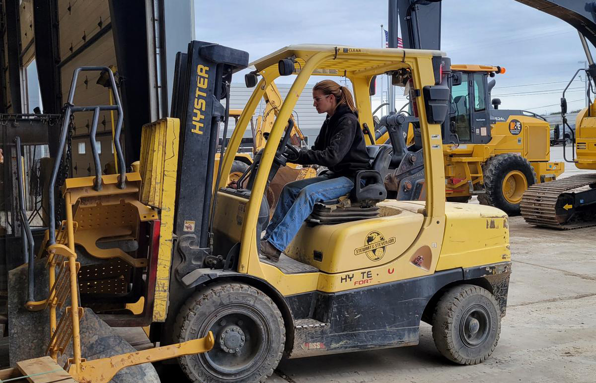 Evelyn Bangs drives a forklift